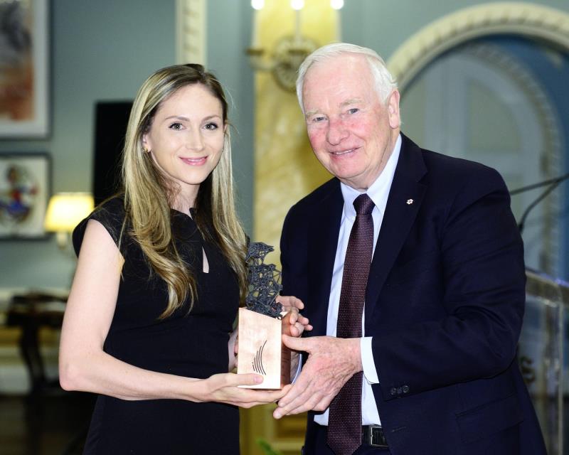 two people posing with award