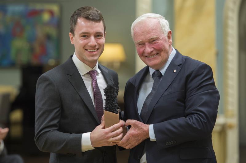 two people posing with award