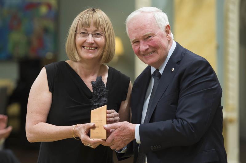 two people posing with award