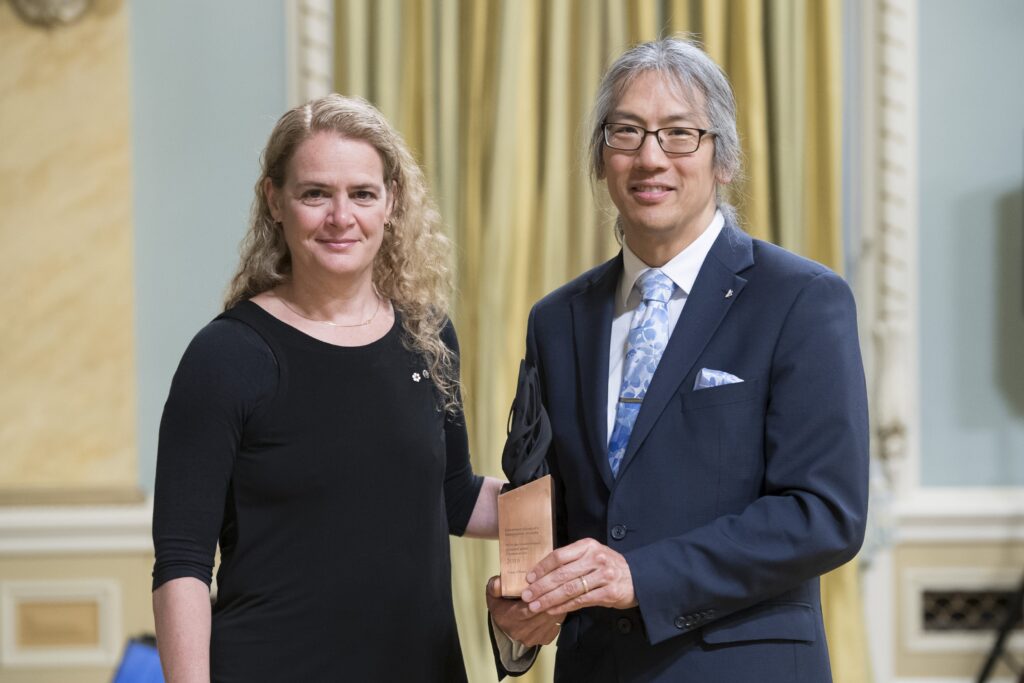 two people posing with award