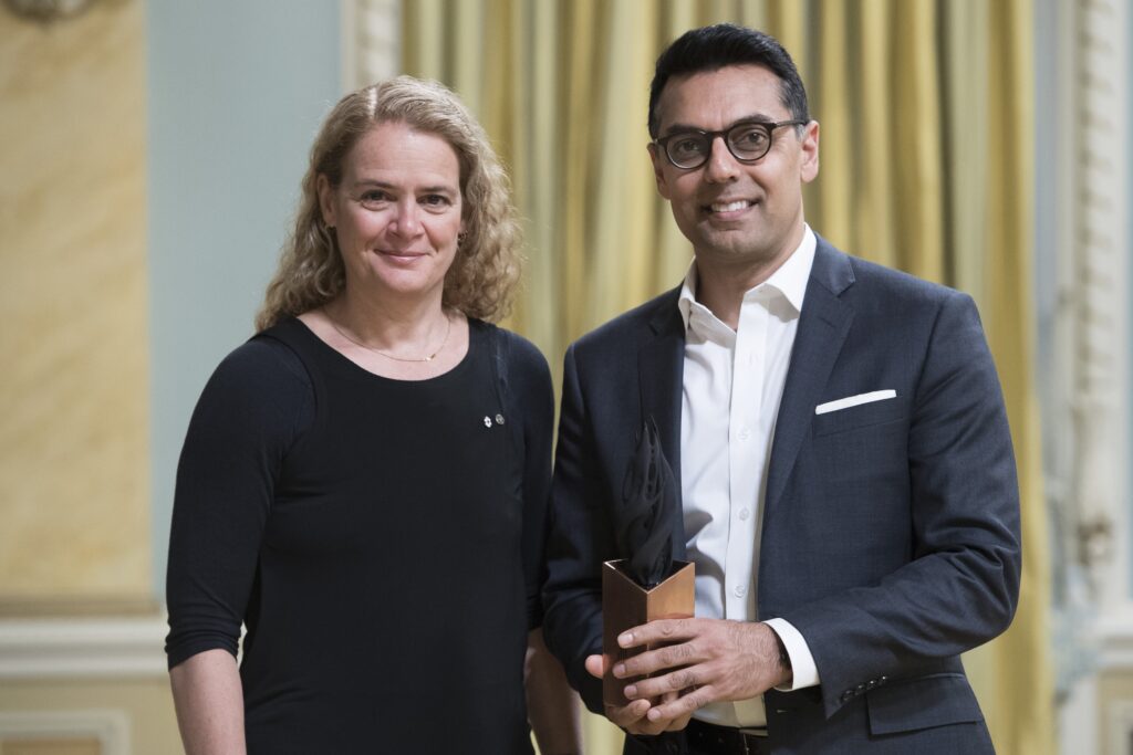 two people posing with award