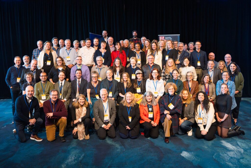 photo of attendees of local new symposium